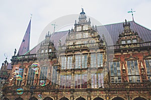 View of Bremen market square with Town Hall, Roland statue and crowd of people, historical center, Germany