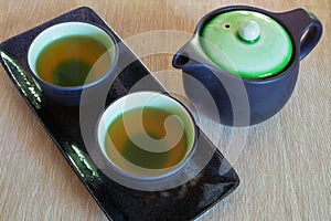 View of the Brewed and healthy Japanese green tea served in traditional hohin and shiboridashi dishes