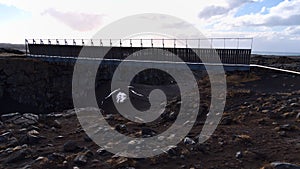 View of the Bridge Between Continents that connects the Eurasian and American tectonic plates over a rock fissure.