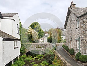 View of the bridge crossing the river with surrounding village houses in cartmel, cumbria