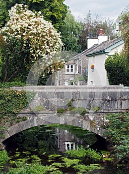 View of the bridge crossing the river with surrounding village houses in cartmel, cumbria