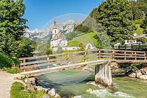 View at the bridge over Ramsau Alm river with Church of St.Sebastian in Ramsau - Germany