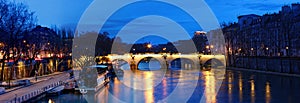 The view of bridge Ponte Marie over Seine river at night , Paris, France. It is one of the oldest bridges in Paris.