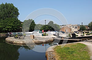 view of brighouse basin with boats and moorings and the lock gates to the calder and hebble navigation canal in west