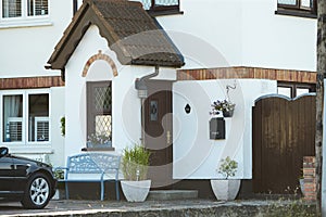 View of brightly Irish house front with traditional colored england entrance door.