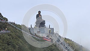 View of the bronze Buddha statue atop Mount Fansipan. Vietnam photo