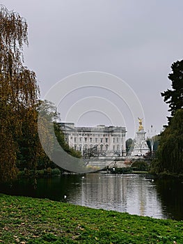 View of Buckingham Palace from St James's Park with a pond in the foreground. London, UK. photo