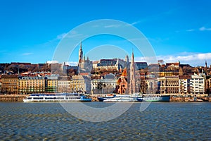 View of the Buda from Pest. The Fisherman`s Bastion, the Matthias Church and Protestant church. Budapest, Hungary