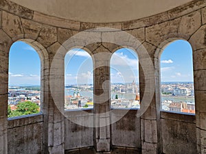 View of Budapest through the columns of the Fisherman`s Bastion