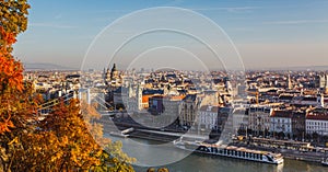 View of Budapest and the river Danube from the Citadella, Hungary at sunrise with beautiful autumn foliage