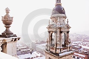 View of Budapest from St. Stephens Basilica, Budapest, Hungary on a snowy foggy day. Ferris wheel Budapest eye seen in the