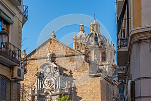 View of the building of the Basilica of Saints Justus and Pastor with street view, Granada, Andalusia, Spain