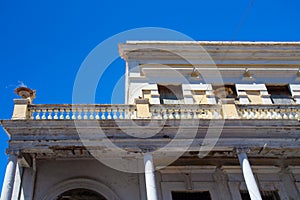 Building in disrepair with typical Caribbean architecture photo