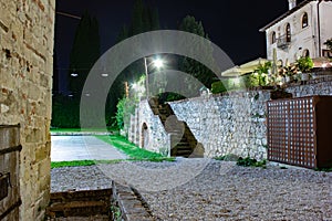 View of a building entrance seen from above. The castle of Asolo is a fortress located in the center of the village of the same na