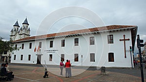 View of the building of the Prefecture of Azuay located in front of the park San Blas