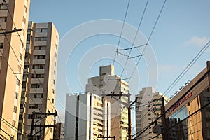 View of a building, trees and electricity poles on a street in the city of Salvador, Bahia