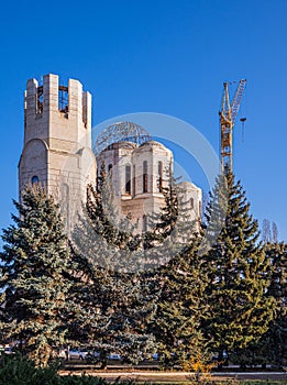 View Of The Building Under Construction Of The Russian Orthodox Church Of The Kiev Patriarchate, Located Behind Coniferous Trees