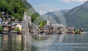 View of buildings in Hallstadt village from Hallstatter See lake in Austria