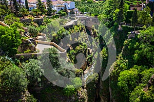 View of buildings over cliff in ronda, spain photo