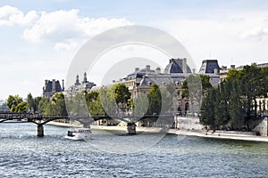 View of buildings and tour boat at Seine river