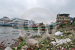 View of the Buriganga river at Sadarghat area with some launches .