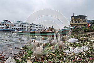 View of the Buriganga river at Sadarghat area with some launches .