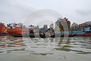 View of the Buriganga river at Sadarghat area with some launches .