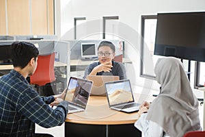 View of business people discussing in meeting room at creative office