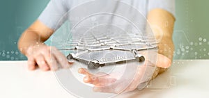 Businessman holding a graphene structure - 3d rendering