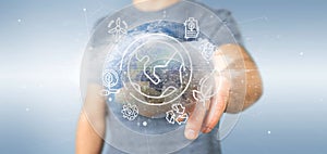 Businessman holding a World globe surronding by ecology icons an photo