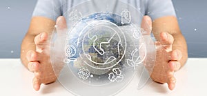 Businessman holding a World globe surronding by ecology icons an photo