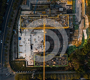 View of a bustling construction site, with workers, heavy machinery