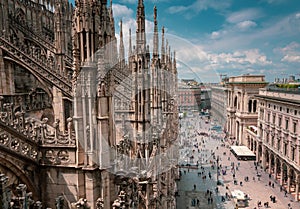 View of the busy Piazza del Duomo from the Milan Cathedral rooftop. Lombardy, Italy.