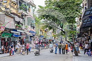 View of busy traffic with many motorbikes and vehicles in Hanoi Old Quarter, capital of Vietnam.