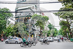 View of busy traffic with motorbikes and vehicles in Hanoi Old Quarter, capital of Vietnam.