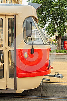 view of the cabin and front doors of an old, red, Czechoslovak tram after repair