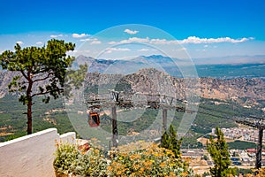 View on the cable car with orange cable cars and Antalya in Turkey