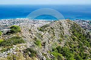 View from Calamorro mountain on mountains, hiking footpath, Mediterranean sea and Benalmadena town. Costa del Sol, province of mal