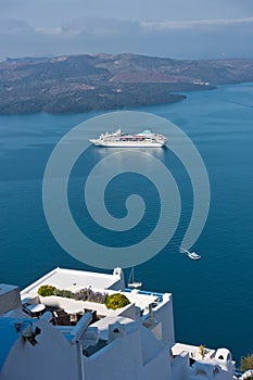 View from Caldera cliff at cruisers and volcanic island, Fira, Santorini