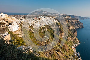 View of Caldera volcanic cliff at sunset, Fira, Santorini island