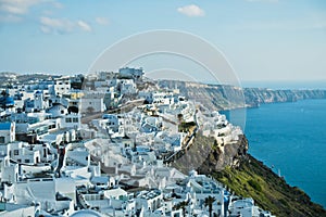 View of Caldera volcanic cliff at sunset, Imerovigli village, Santorini island