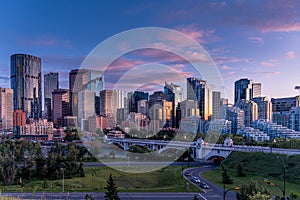 View of Calgary`s skyline at night along the Bow
