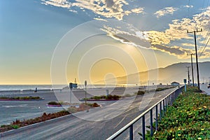 View of California coastal road at sunset.