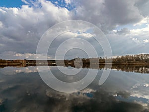 The view of the calm lake, the blue sky