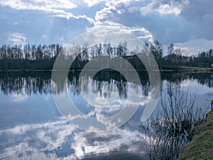 The view of the calm lake, the blue sky