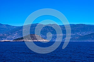 View of calm Mediterranean sea with mountain, rocky islands