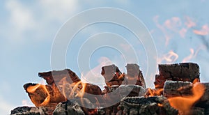 View of a campfire made of stacked logs photo