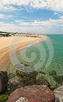 View of campsite by rocky beach on sunny day photo