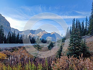 View of the Canadian Rockies from a driving car in Banff National Park, Alberta, Canada