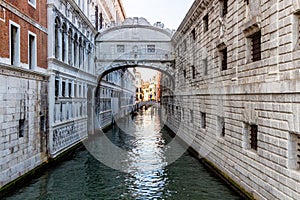 View of the canal with boats and gondolas in Venice, Italy. Venice is a popular tourist destination of Europe